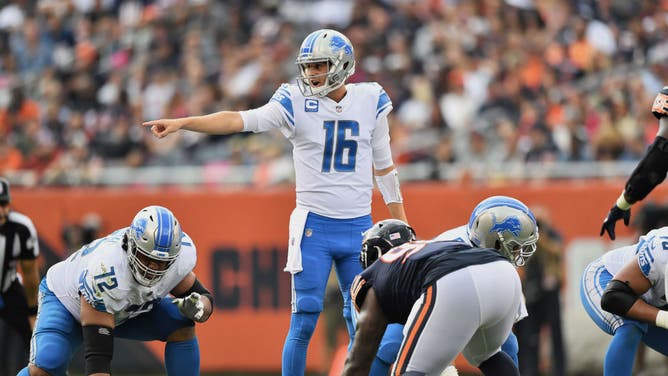 Detroit Lions QB Jared Goff directing the offense against the Chicago Bears at Soldier Field in Chicago.