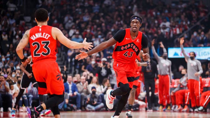 Raptors PG Fred VanVleet high-fives PF Pascal Siakam at Scotiabank Arena in Toronto, Canada.