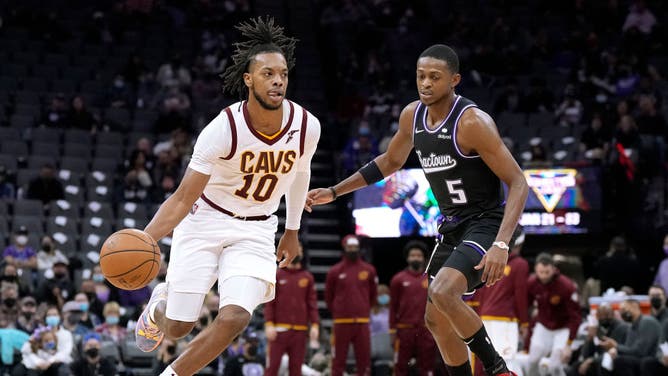 Cleveland Cavaliers PG Darius Garland drives to the basket on Sacramento Kings PG De'Aaron Fox during the 3rd quarter at Golden 1 Center in Sacramento, California.