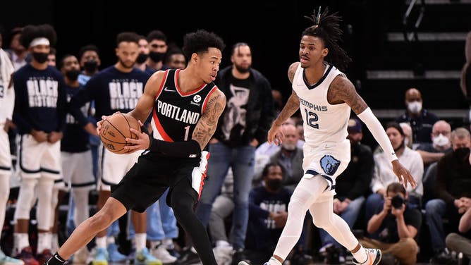 Portland Trail Blazers Anfernee Simons handles the ball against Memphis Grizzlies' Ja Morant at FedExForum in Memphis, Tennessee.