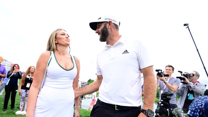 Team Captain Dustin Johnson of 4 Aces GC celebrates with wife Paulina Gretzky