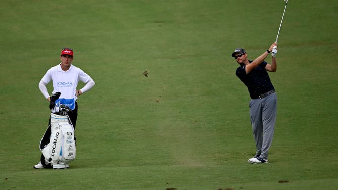 Adam Schenk plays a shot on the 9th hole during the 2nd round of the 2022 Wyndham Championship at Sedgefield.