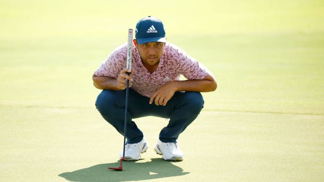 Xander Schauffele lines up a putt on the 18th green during the final round of the 2022 TOUR Championship at East Lake.