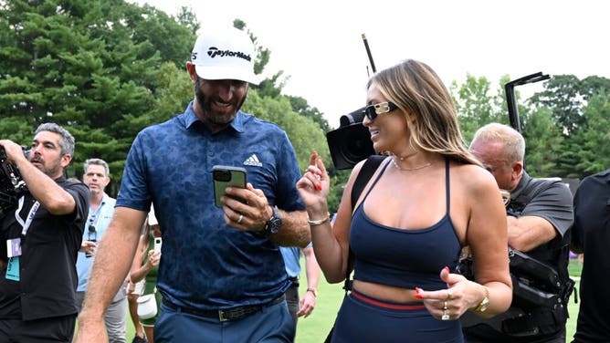 Dustin Johnson celebrates with wife, Paulina Gretzky, after winning the LIV Golf Invitational - Boston