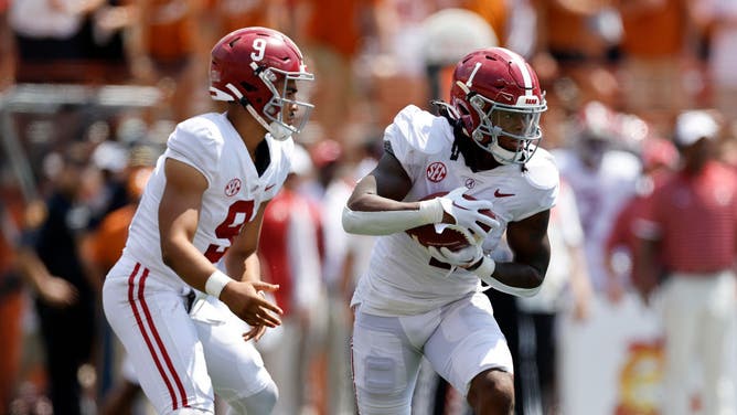 Alabama Crimson Tide RB Jahmyr Gibbs takes the handoff from QB Bryce Young against the Texas Longhorns at Darrell K Royal-Texas Memorial Stadium in Austin.