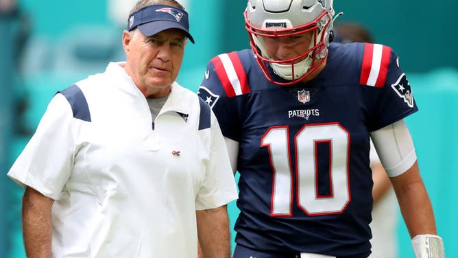 Patriots head coach Bill Belichick and Mac Jones look on during pregame in Miami.