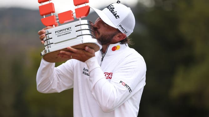 Max Homa celebrates with the trophy after winning the Fortinet Championship at Silverado Resort and Spa North course in Napa, California.