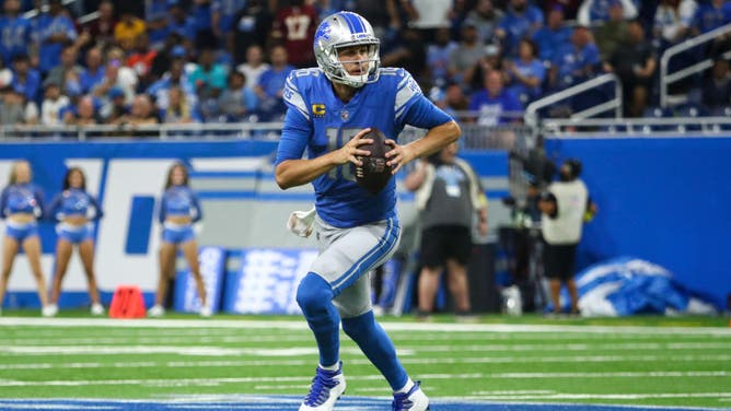 Detroit Lions QB Jared Goff scrambles with the ball against the Washington Commanders at Ford Field in Detroit.