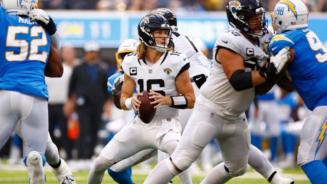 Jaguars QB Trevor Lawrence attempts a pass against the Los Angeles Chargers at SoFi Stadium in Inglewood, California.