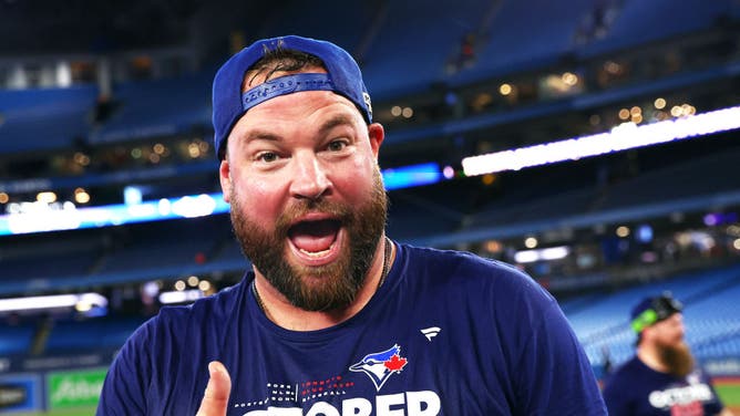 Manager John Schneider of the Toronto Blue Jays celebrates clinching a playoff spot after the win against the Boston Red Sox.