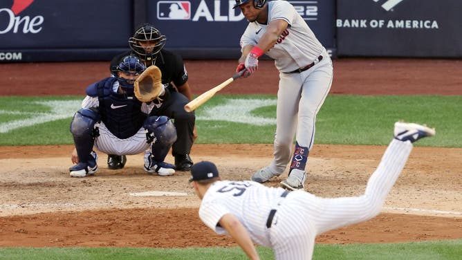 Guardians RF Oscar Gonzalez hits a RBI single to score Jose Ramirez during the 10th inning vs. the New York Yankees in the ALDS at Yankee Stadium.