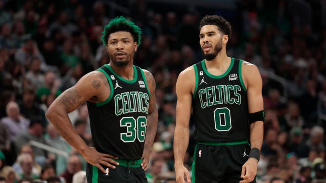 Boston Celtics SF Jayson Tatum and PG Marcus Smart side-eyeing an official at the TD Garden in Boston.