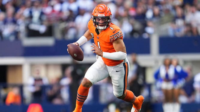 Chicago Bears QB Justin Fields scrambles against the Dallas Cowboys at AT&T Stadium in Arlington, Texas.