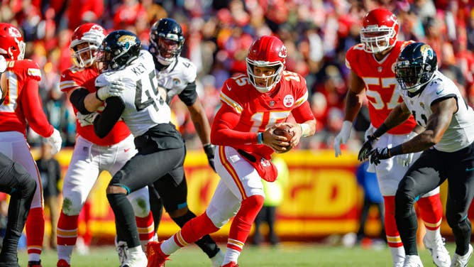 Kansas City Chiefs QB Patrick Mahomes scrambles from defensive pressure by the Jacksonville Jaguars at Arrowhead Stadium in Kansas City, Missouri.