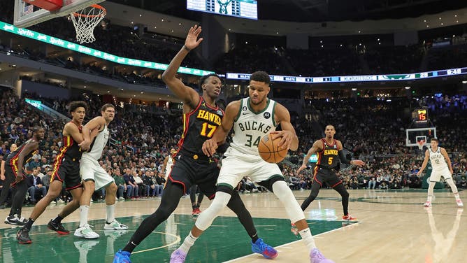 Giannis Antetokounmpo is defended by Atlanta Hawks big Onyeka Okongwu at Fiserv Forum in Milwaukee, Wisconsin.