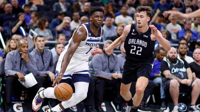 Timberwolves wing Anthony Edwards drives on Magic wing Franz Wagner at Amway Center in Orlando, Florida.