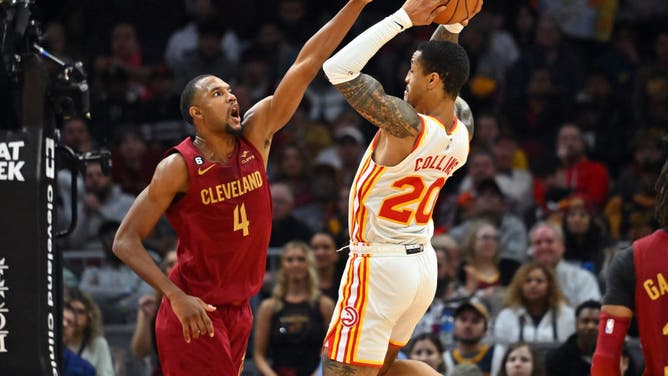 Cleveland Cavaliers big Evan Mobley defending Atlanta Hawks PF John Collins at Rocket Mortgage Fieldhouse in Cleveland, Ohio.