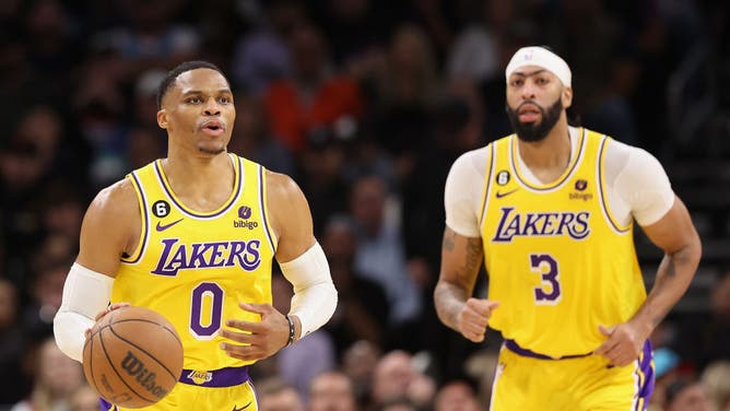 Los Angeles Lakers PG Russell Westbrook handles the ball alongside big Anthony Davis at Footprint Center in Phoenix, Arizona.