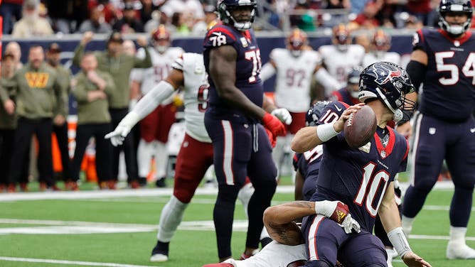 Texans QB Davis Mills getting sacked.