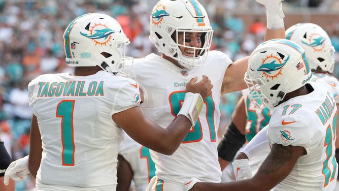 Miami Dolphins TE Durham Smythe celebrates a TD with QB Tua Tagovailoa and WR Jaylen Waddle against the Houston Texans at Hard Rock Stadium in Miami Gardens, Florida.