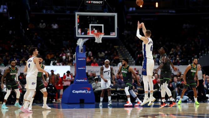 Kristaps Porzingis hits a 1st half 3-pointer vs. the Timberwolves at Capital One Arena in Washington, DC.