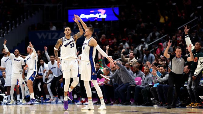 Washington Wizards big Kristaps Porzingis hitting a 3-pointer with teammate Kyle Kuzma against the Minnesota Timberwolves at Capital One Arena in Washington, DC.