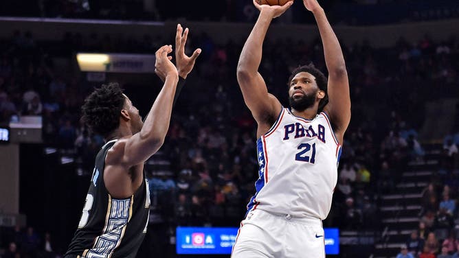 Joel Embiid shoots over Jaren Jackson Jr. at FedExForum in Memphis, Tennessee.