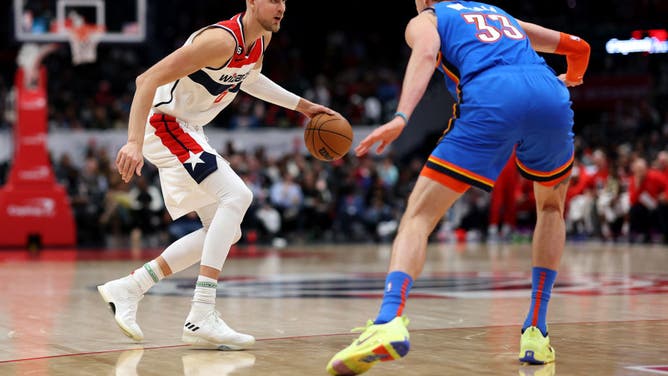 Washington Wizards PF Kristaps Porzingis dribbles against Oklahoma City Thunder C Mike Muscala at Capital One Arena in Washington, DC.