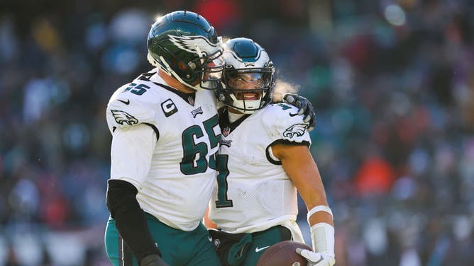 Philadelphia Eagles QB Jalen Hurts celebrates a TD with RT Lane Johnson against the Chicago Bears at Soldier Field in Chicago.