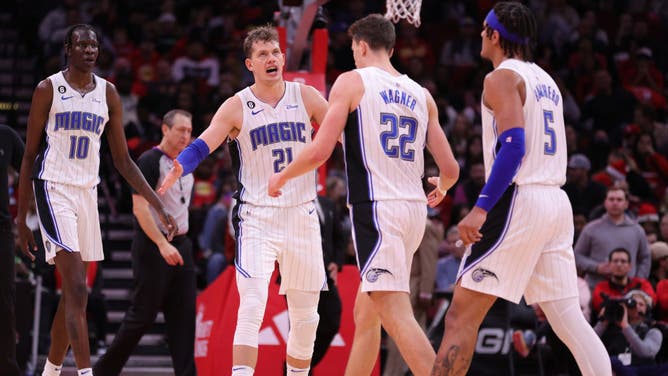 Orlando Magic big Moritz Wagner high-fives wing Franz Wagner during the 2nd half against the Houston Rockets at Toyota Center in Houston, Texas.
