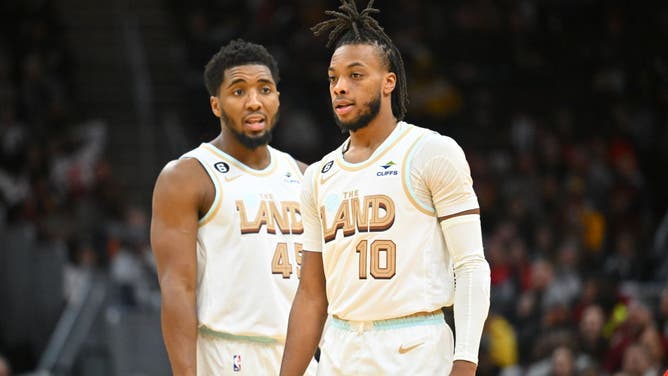 Cleveland Cavaliers guards Darius Garland and Donovan Mitchell talk during a free-throw against the Toronto Raptors at Rocket Mortgage Fieldhouse in Cleveland, Ohio.