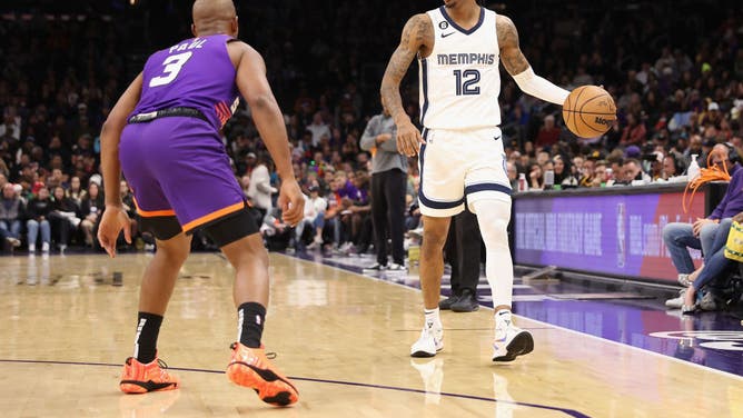 Memphis Grizzlies PG Ja Morant handles the ball against Phoenix Suns PG Chris Paul at Footprint Center Phoenix, Arizona.