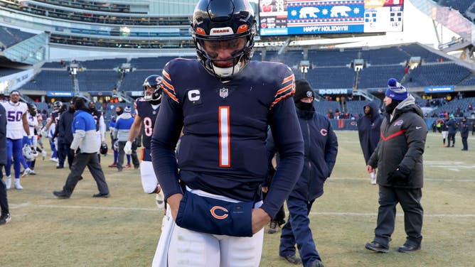 Bears QB Justin Fields walks off the field after a loss to the Buffalo Bills at Soldier Field.