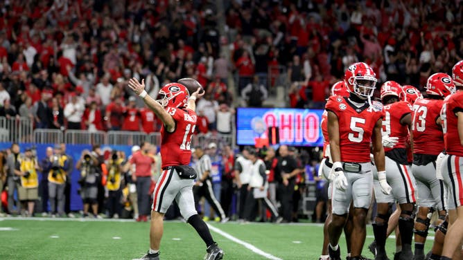 Georgia Bulldogs QB Stetson Bennett celebrates after running out the clock to defeat the Ohio State Buckeyes in the Chick-fil-A Peach Bowl at Mercedes-Benz Stadium in Atlanta.