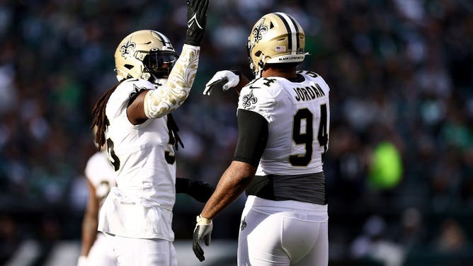 New Orleans Saints LB Demario Davis and pass rusher Cameron Jordan high-five against the Philadelphia Eagles at Lincoln Financial Field in Philadelphia.