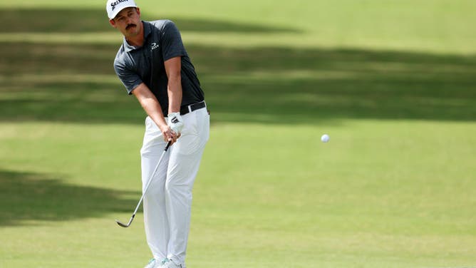 Andrew Putnam chips on the 17th green during the final round of the 2023 Sony Open at Waialae Country Club in Honolulu, Hawaii.