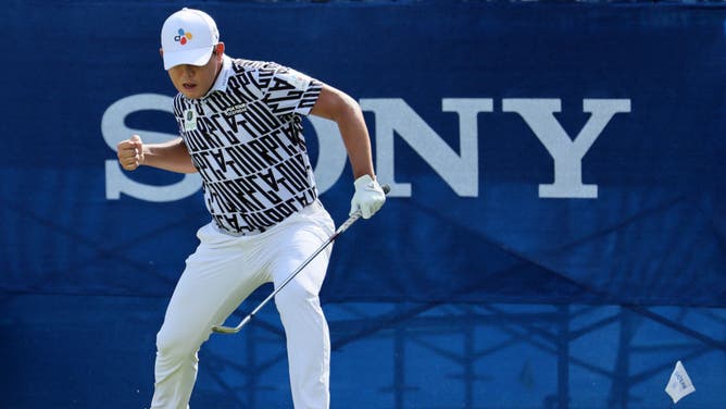 Si Woo Kim reacts to his birdie putt on the 18th green during the final round of the Sony Open in Hawaii at Waialae Country Club in Honolulu, Hawaii.