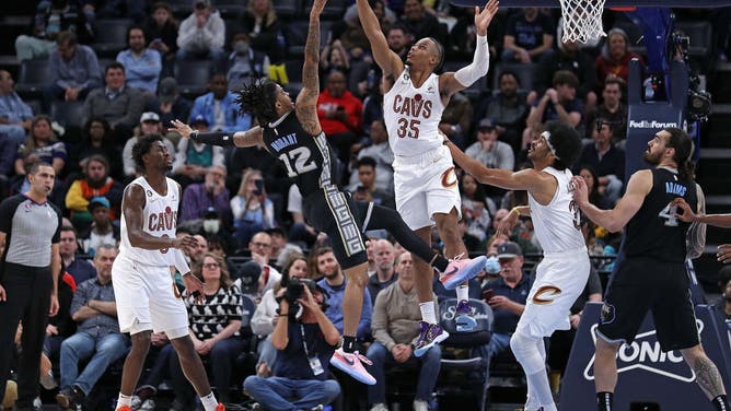 Grizzlies' Ja Morant attacks the rim vs. Cavaliers wing Isaac Okoro #35 of the Cleveland Cavaliers at FedExForum in Memphis, Tennessee.