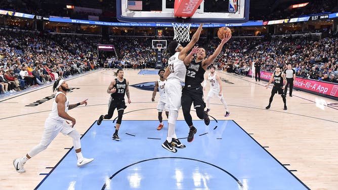 Grizzlies SG Desmond Bane goes to the basket vs. Cavaliers big Jarrett Allen at FedExForum in Memphis, Tennessee.