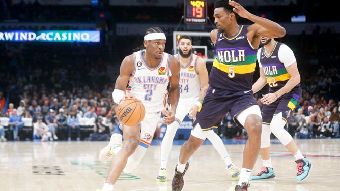 Shai Gilgeous-Alexander drives past Herbert Jones at Paycom Center in Oklahoma City.