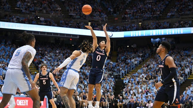 Virginia PG Kihei Clark shoots against North Carolina G R.J. Davis at the Dean E. Smith Center in Chapel Hill, North Carolina.
