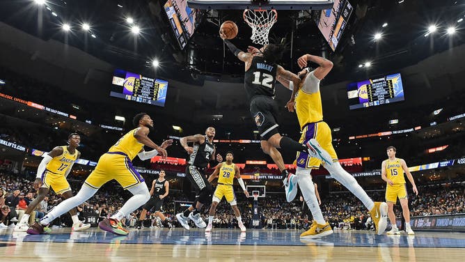 Ja Morant getting to the rack on Anthony Davis at FedExForum in Memphis, Tennessee.