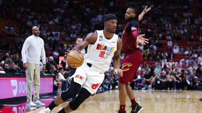 Heat wing Jimmy Butler drives to the basket on Cavaliers PG Darius Garland at Miami-Dade Arena in Miami.