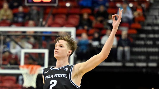 Utah State Aggies' Sean Bairstow reacts after making a 3-pointer vs. the Boise State Broncos during the Mountain West basketball tournament at the Thomas & Mack Center in Las Vegas.
