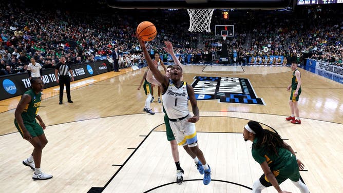 Marquette Golden Eagles SF Kam Jones gets to the basket on the Vermont Catamounts in the 1st round game of the NCAA Tournament at Nationwide Arena in Columbus, Ohio.