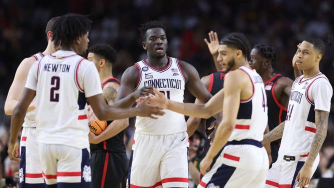 The UConn Huskies celebrate during the NCAA Men's Basketball Tournament National Championship vs. the San Diego State Aztecs at NRG Stadium in Houston, Texas.