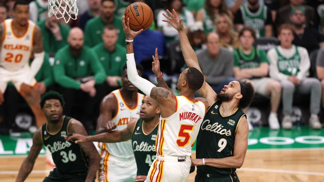 Hawks G Dejounte Murray gets to the rack on the Celtics in Game 1 of the NBA Eastern Conference 1st-Round Playoffs at TD Garden in Boston.