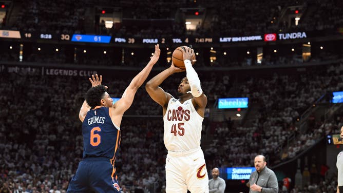 Mitchell shoots over Grimes in Game 1 of the Eastern Conference 1st-Round Playoffs at Rocket Mortgage Fieldhouse in Cleveland.