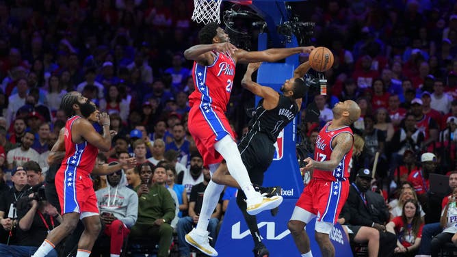 76ers C Joel Embiid blocks Nets SF Mikal Bridges during Game 1 of the Eastern Conference First Round Playoffs at the Wells Fargo Center in Philadelphia.