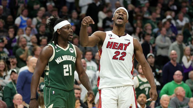 Miami Heat SF Jimmy Butler and Bucks PG Jrue Holiday exchange words during Game 5 of the Eastern Conference First Round Playoffs at Fiserv Forum in Milwaukee, Wisconsin.